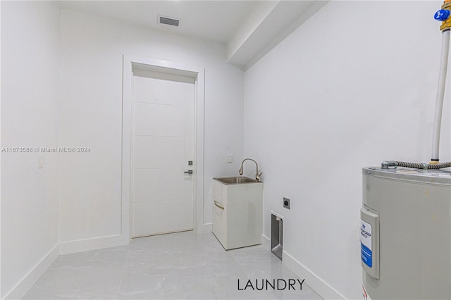 clothes washing area featuring water heater, sink, and electric dryer hookup