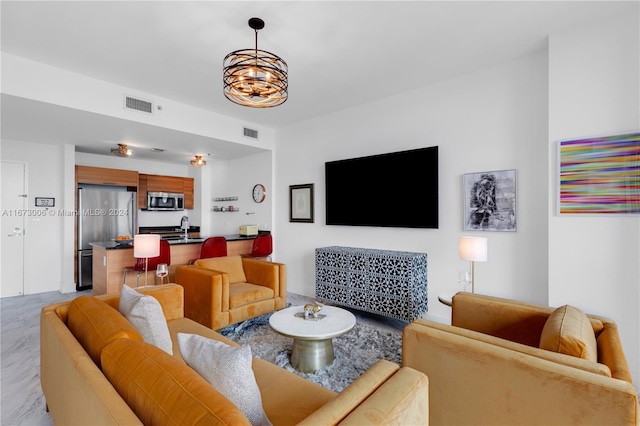 living room featuring a chandelier