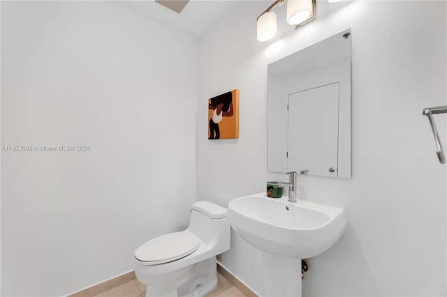 bathroom featuring tile patterned floors and toilet