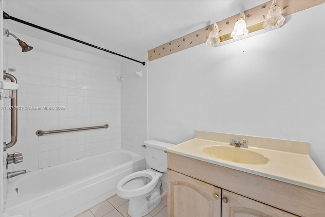 full bathroom with tile patterned floors, vanity, toilet, and tiled shower / bath