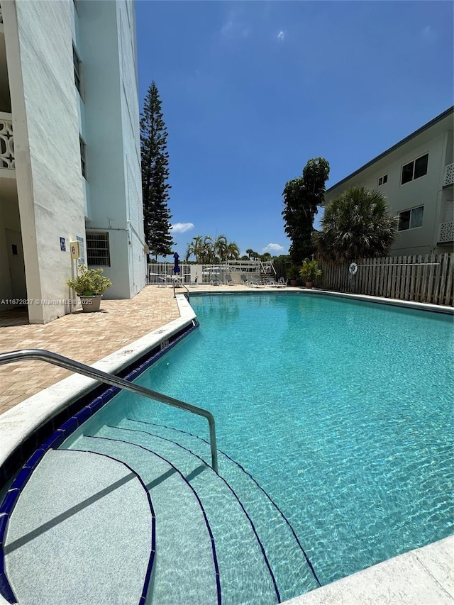 view of swimming pool featuring a patio