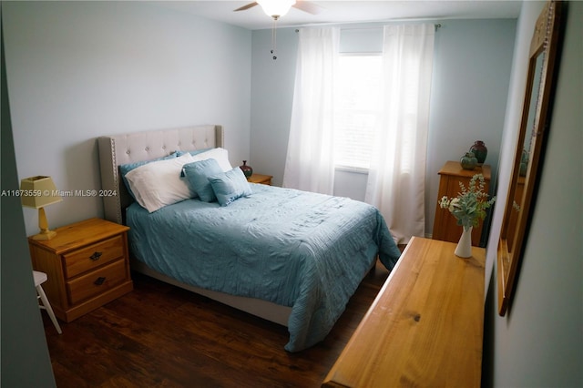 bedroom with ceiling fan and dark hardwood / wood-style flooring