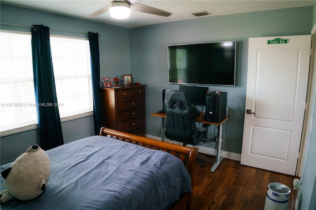 bedroom featuring ceiling fan and dark hardwood / wood-style flooring