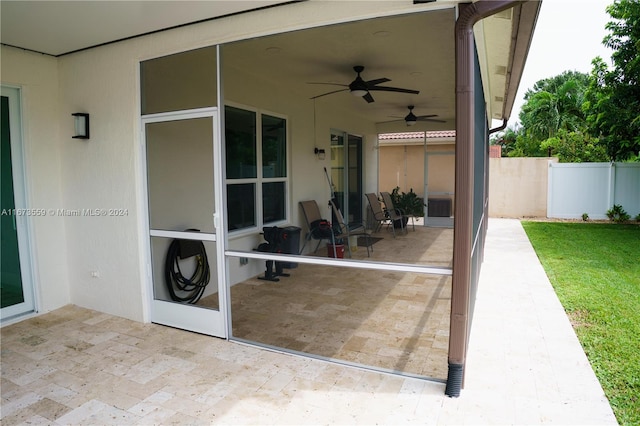 view of patio featuring ceiling fan