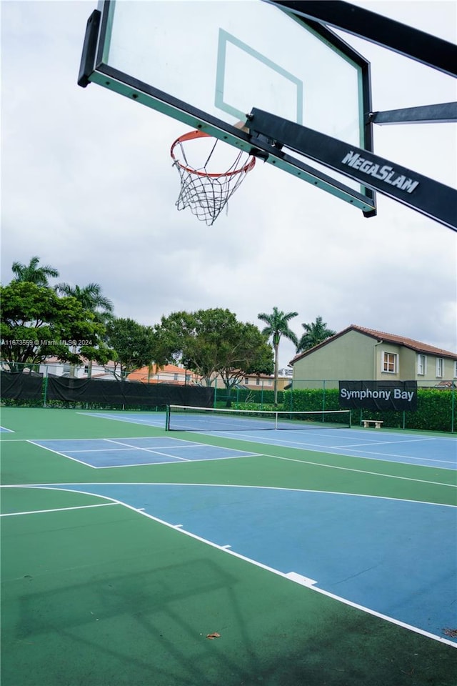 view of sport court featuring basketball hoop