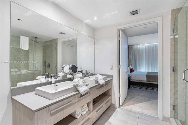 bathroom with an enclosed shower and vanity