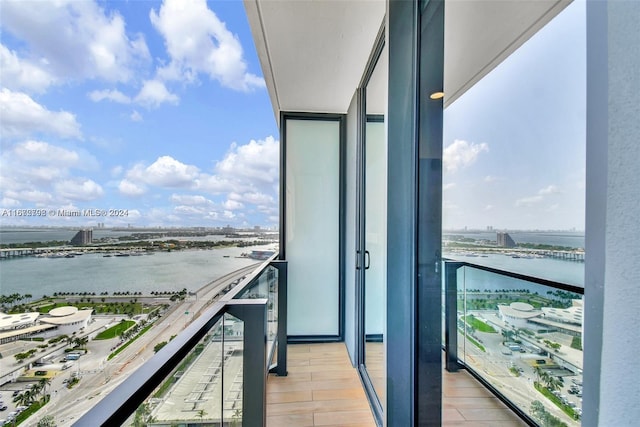 balcony featuring a water view