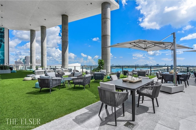 view of patio / terrace featuring an outdoor living space and a water view