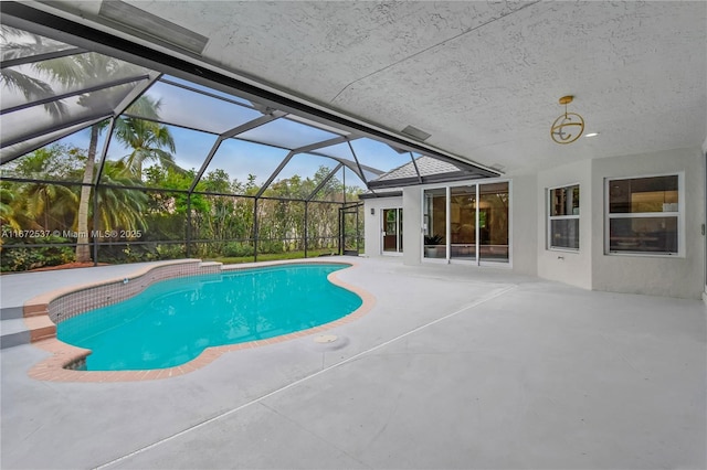 view of pool featuring a lanai and a patio area