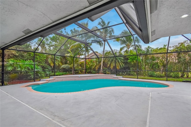 view of pool featuring a patio and a lanai