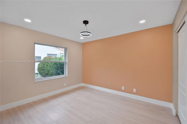 unfurnished room featuring light hardwood / wood-style flooring