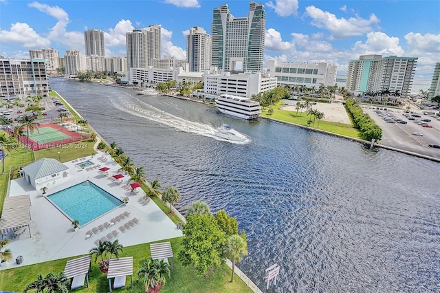 birds eye view of property with a water view