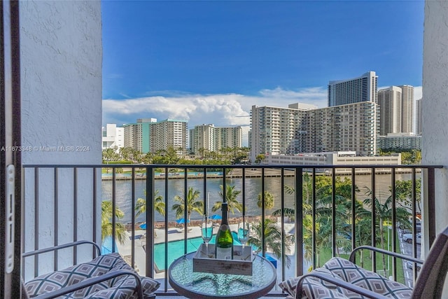 balcony featuring a water view