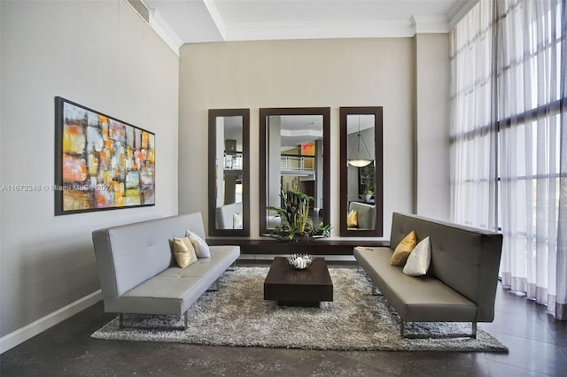 living area with crown molding