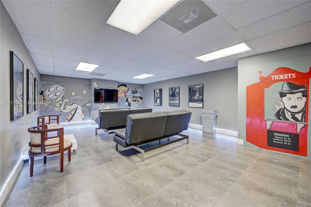 living room with a drop ceiling