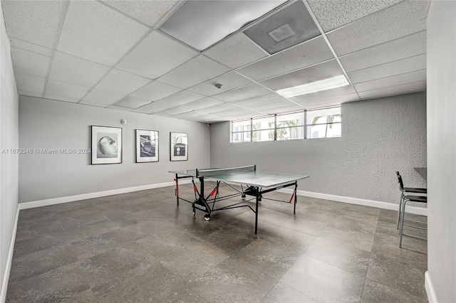 game room featuring a drop ceiling