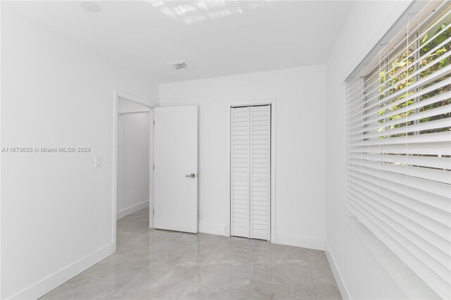 unfurnished bedroom featuring a closet