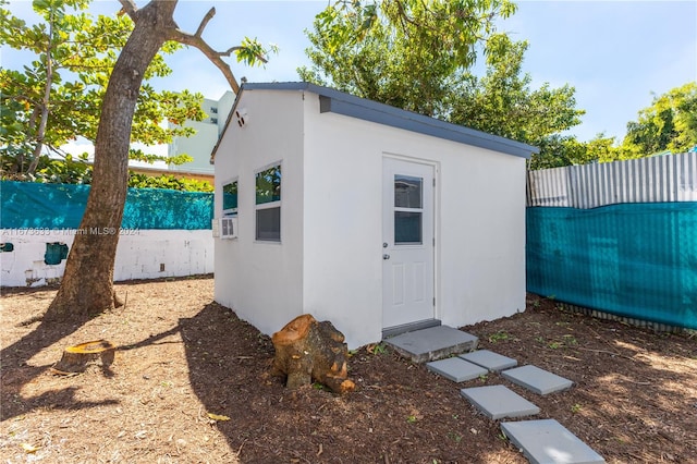 view of outbuilding featuring cooling unit