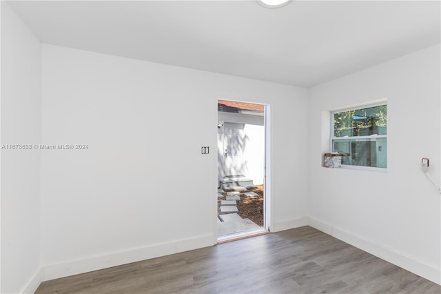 unfurnished room featuring hardwood / wood-style flooring