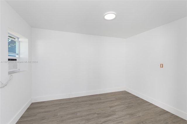 spare room featuring hardwood / wood-style floors