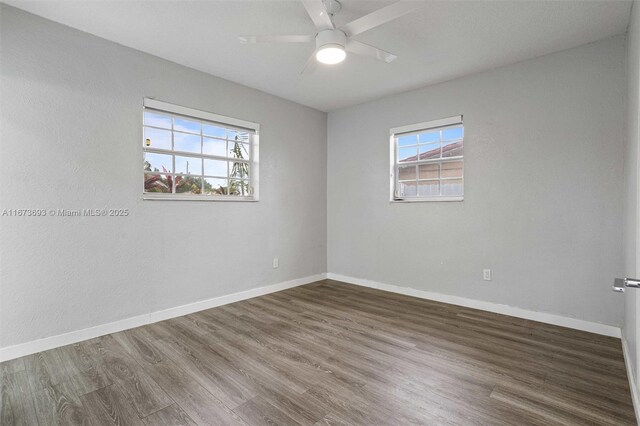 bedroom featuring dark wood-type flooring and ceiling fan