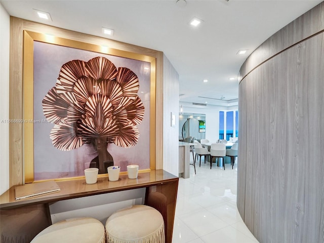 hall with light tile patterned flooring