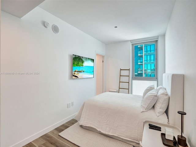 bedroom featuring wood-type flooring