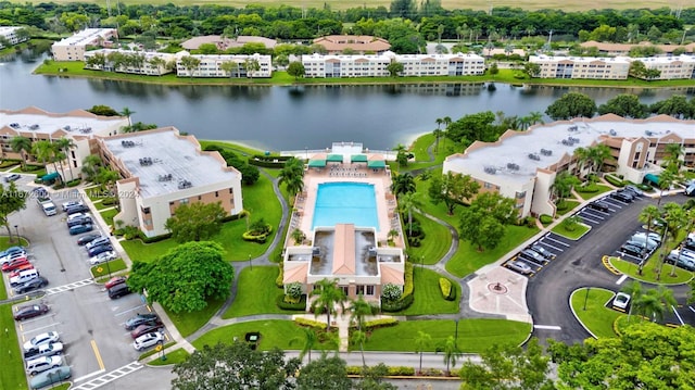 birds eye view of property with a water view