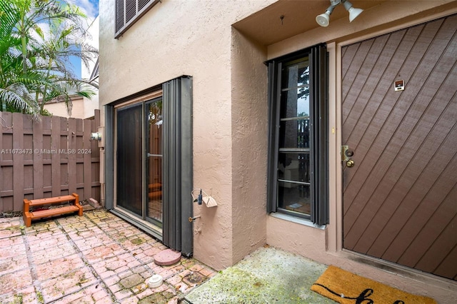 property entrance with a patio