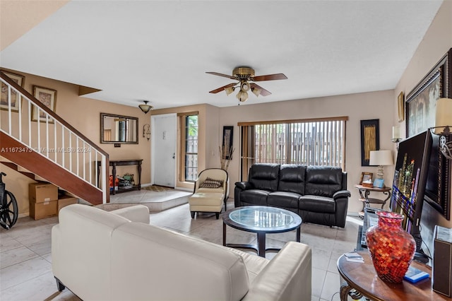 tiled living room featuring ceiling fan