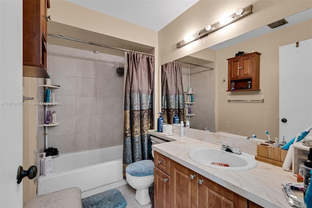 full bathroom featuring tile patterned flooring, vanity, toilet, and shower / tub combo