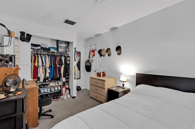 bedroom featuring a closet and carpet flooring