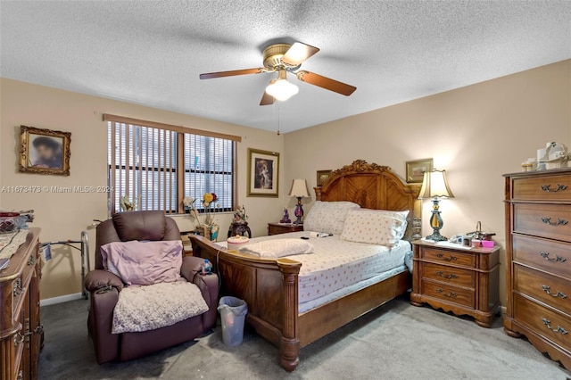 carpeted bedroom with a textured ceiling and ceiling fan