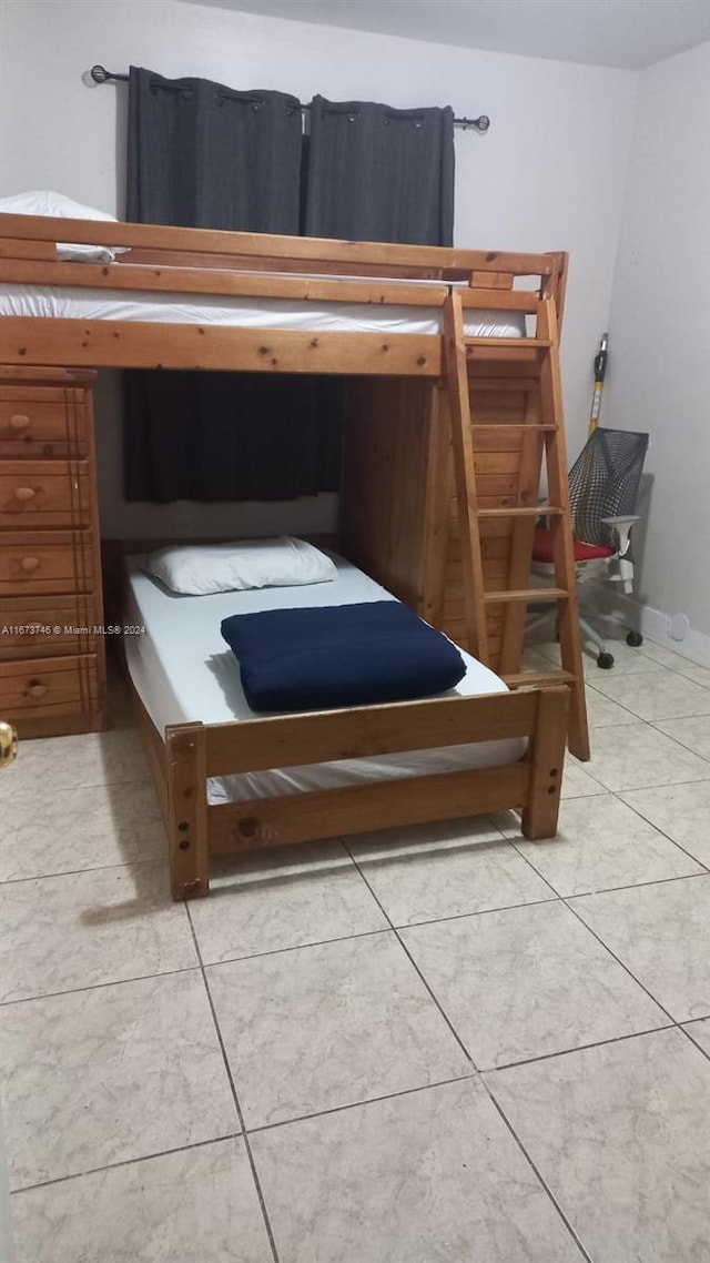 unfurnished bedroom featuring tile patterned floors