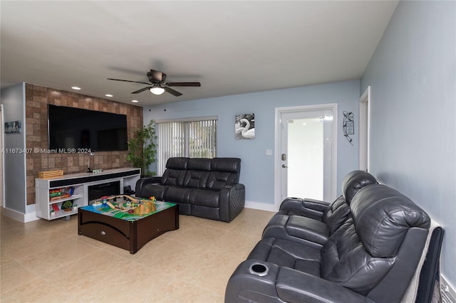 tiled living room with ceiling fan