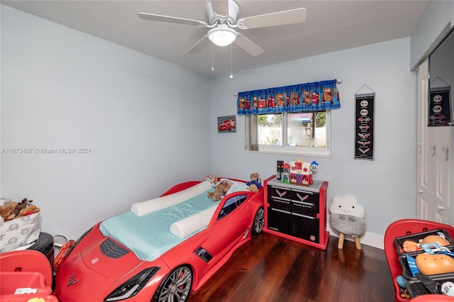 bedroom with ceiling fan and dark wood-type flooring