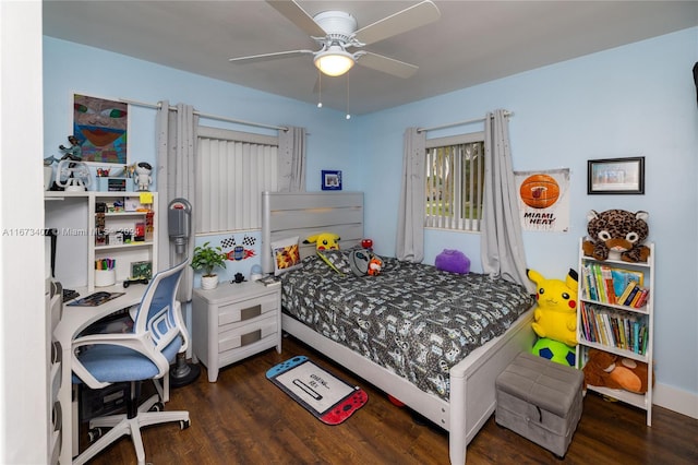 bedroom with ceiling fan and dark hardwood / wood-style floors