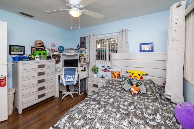 bedroom with ceiling fan and dark wood-type flooring