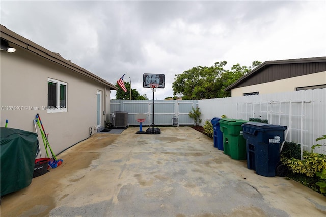 view of patio with area for grilling and central air condition unit