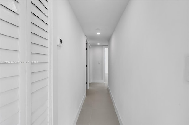 hallway featuring light tile patterned floors