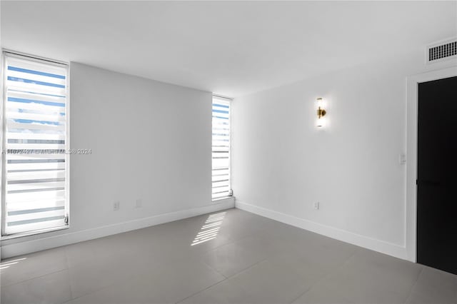 empty room featuring tile patterned flooring