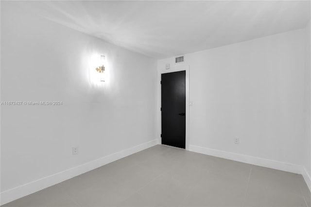 empty room with tile patterned floors