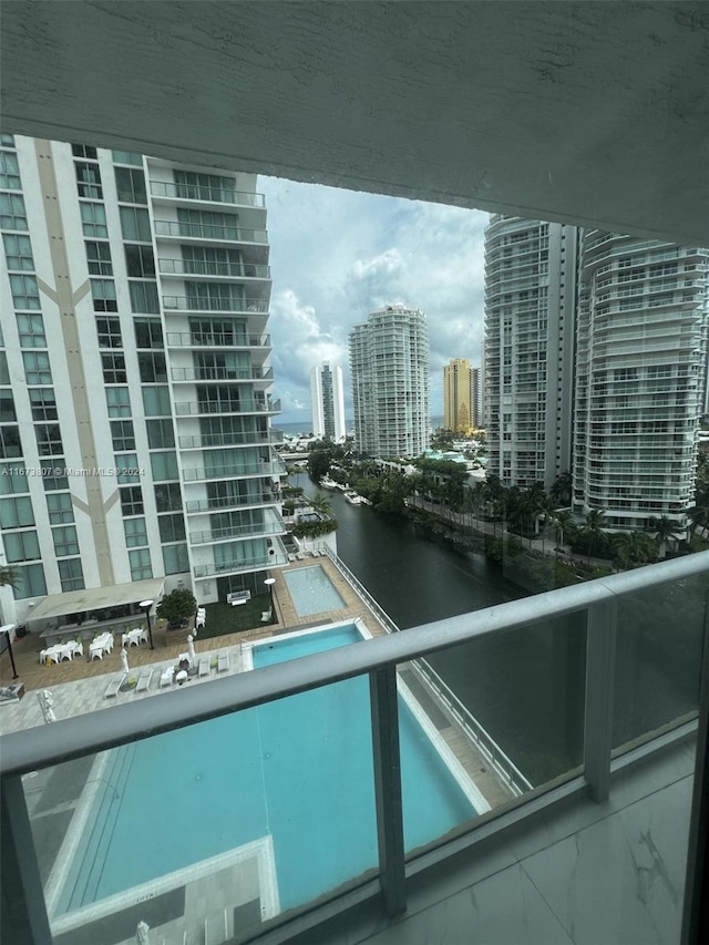 view of pool with a water view