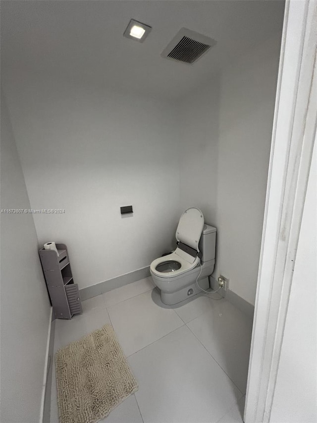 bathroom featuring tile patterned flooring and toilet