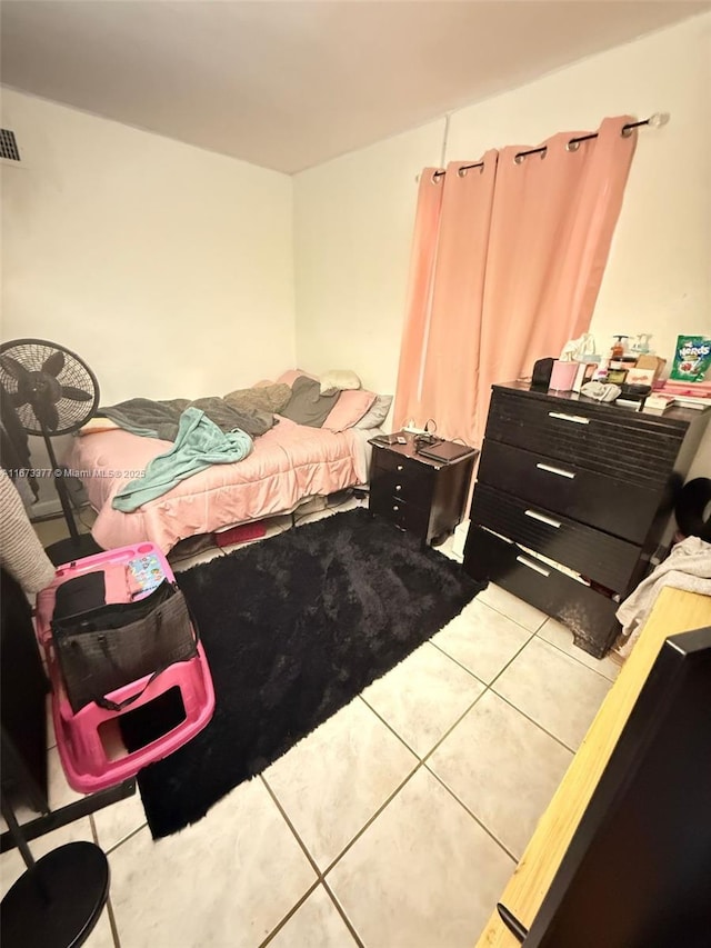 bedroom featuring tile patterned flooring and visible vents