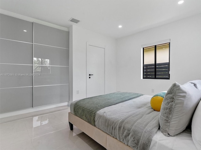 bedroom with recessed lighting and visible vents