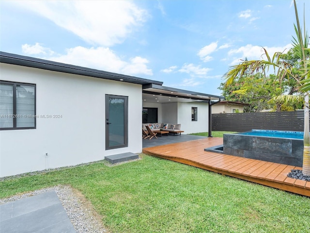 exterior space featuring a wooden deck and a yard