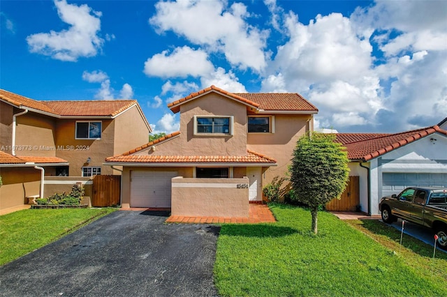 mediterranean / spanish house with a front lawn