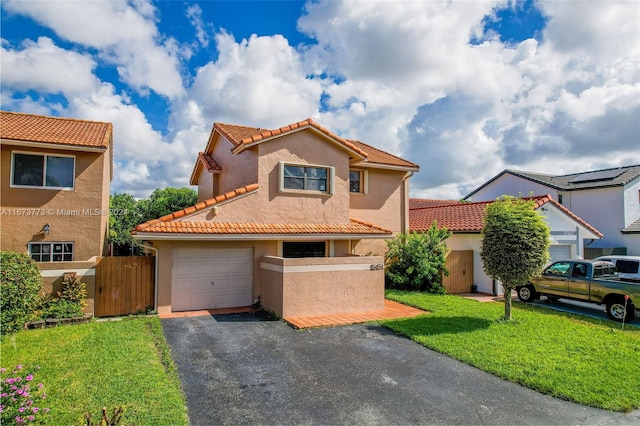 mediterranean / spanish-style home with a front lawn