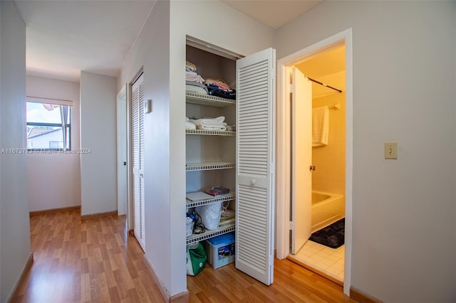 hallway featuring wood-type flooring